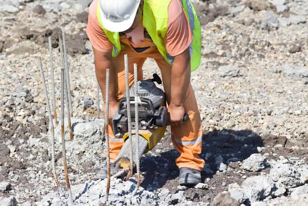 man operating heavy drill needs hand-arm vibration risk assessments